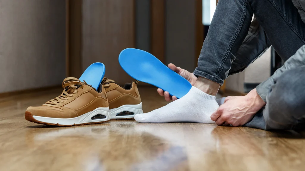 Man Sits On The Floor With Custom Shoe Insert