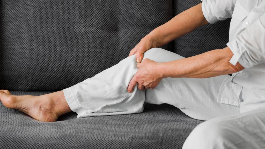 Woman Holds Right Leg Because Of Sciatica Pain